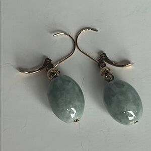 Gold tone hook and heavy stone gray/green mottled stones. Gorgeous!